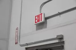 MaxLite Exit Light - Emergency Battery Backup - Red -Lighting Decoration Store ex rwrc installed up close warehouse