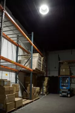 LED UFO High Bay - Field Selectable Power And Color - Up To 33,600 Lumens - Optional Motion Sensor - 150W / 200W / 240W - 3500K / 4000K / 5000K -Lighting Decoration Store hbud 50k150w prism illuminated in warehouse side view 1