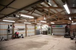 4' LED Strip Light Fixture / Shop Light - Selectable CCT And Wattage - Up To 6250 Lumens - 3500K / 4000K / 5000K - 30W / 40W / 50W -Lighting Decoration Store lsfd sw3c40w h illuminating garage side view 1