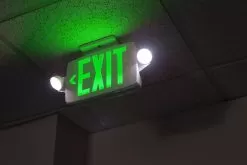 Combo LED Emergency Exit Sign - Battery Backup - Adjustable Light Heads - Single Or Double Face - Red / Green -Lighting Decoration Store xsc g close up on installed 1