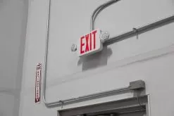 MaxLite Combination Emergency Exit Light - Emergency Battery Backup - Adjustable Light Heads - Red -Lighting Decoration Store xsc rwrc installed up close warehouse