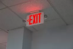 Combo LED Emergency Exit Sign - Battery Backup - Adjustable Light Heads - Single Or Double Face - Red / Green -Lighting Decoration Store xsc x close up installed 1