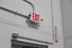 Combo LED Emergency Exit Sign - Battery Backup - Adjustable Light Heads - Single Or Double Face - Red / Green -Lighting Decoration Store xsc x installed up close warehouse 1